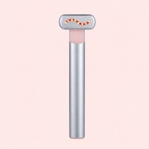 A silver T-shaped lip balm tube with a pink inner balm chamber and a small red and yellow wavy accent on the top cap, centered on a pale pink background.