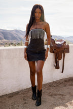 Back view of the black rhinestone fringe strapless denim mini dress